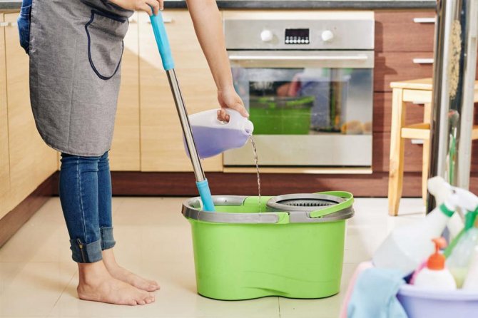 housewife-pouring-floor-cleaning-liquid-001.jpg