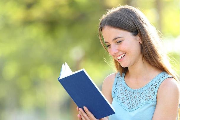 stock-photo-happy-woman-reading-a-book.jpg